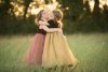 two-girls-hugging-in-a-field-by-Sally-Kate-Photography.jpg